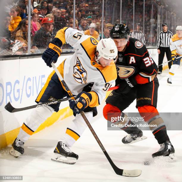 Matt Duchene of the Nashville Predators and Jakob Silfverberg of the Anaheim Ducks battle for the puck during the second period at Honda Center on...