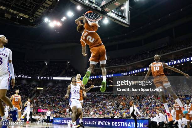 Texas Longhorns guard Arterio Morris goes high above the rim for a dunk in the second half of the Big 12 basketball tournament championship game...