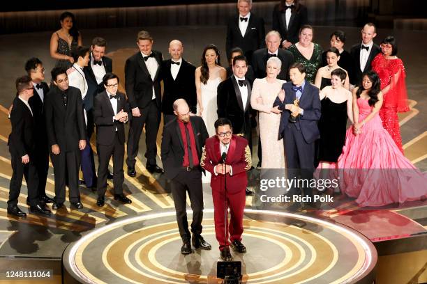 Daniel Scheinert and Daniel Kwan accept the Oscar for Best Picture for "Everything Everywhere All at Once" with the rest of the Cast at the 95th...