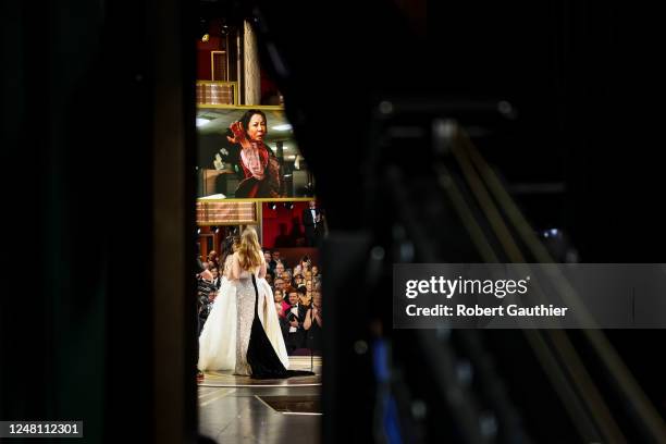 Michelle Yeoh accepts the Best Actress award for "Everything Everywhere All at Once" from Jessica Chastain and Halle Berry at the 95th Academy Awards...