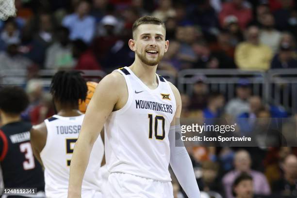 West Virginia Mountaineers guard Erik Stevenson smiles in the second half of a Big 12 Tournament basketball game between the Texas Tech Red Raiders...