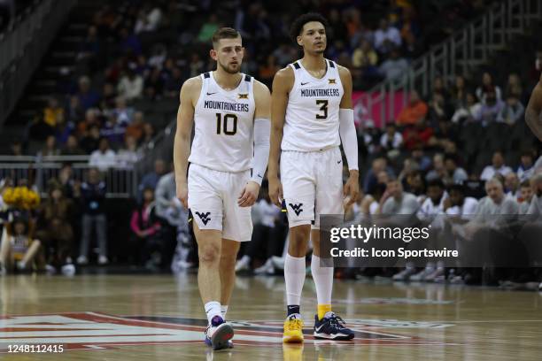 West Virginia Mountaineers guard Erik Stevenson and forward Tre Mitchell in the first half of a Big 12 Tournament basketball game between the Texas...