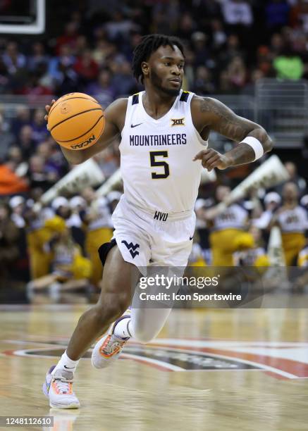 West Virginia Mountaineers guard Joe Toussaint with the ball in the first half of a Big 12 Tournament basketball game between the Texas Tech Red...