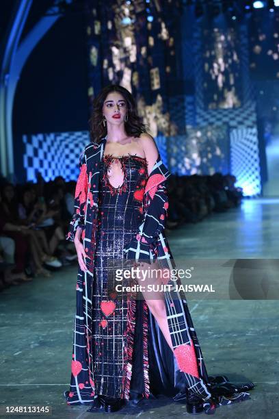Bollywood actress Ananya Panday presents a creation by designer Manish Malhotra during the Lakmé Fashion Week x FDCI, in Mumbai on March 12, 2023. /...