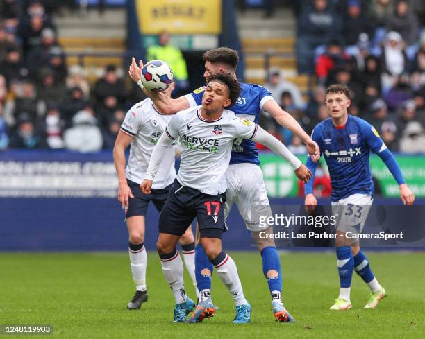 Bolton Wanderers' Shola Shoretire battles for possession with Ipswich Town's George Hirst during the Sky Bet League One between Bolton Wanderers and...