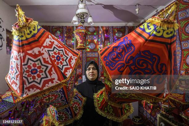 Palestinian artisan Reham Shurab makes traditional "fanous" lanterns for decoration ahead of the holy Muslim month of Ramadan, at her home workshop...