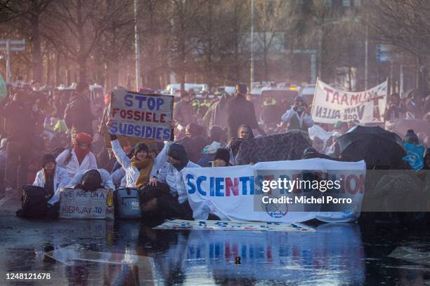 Scientist Rebellion activists block the A12 highway during an Extinction Rebellion protest on March 11, 2023 in The Hague, Netherlands. Protesters...