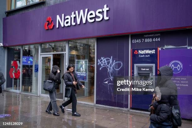 Street scene in the rain outside the Nat West Bank on Whitechapel High Street on 8th March 2023 in London, United Kingdom. National Westminster Bank,...