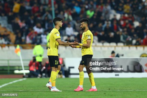 Aria Yousefi of Sepahan S.C. Substitutes with Ramin Rezaeian of Sepahan S.C. During the Persian Gulf Pro League match between Persepolis and Sepahan...