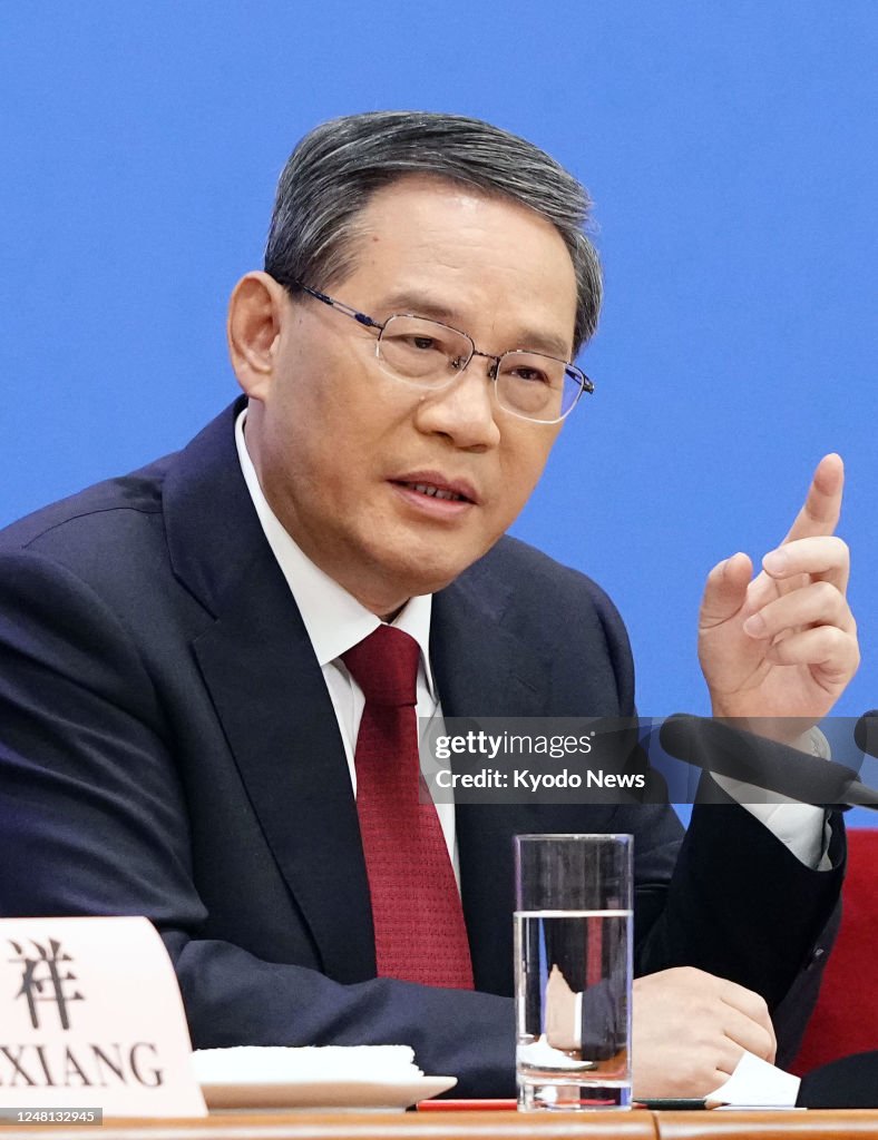 Li Quang New Chinese Premier Li Qiang speaks at his first press conference ...
