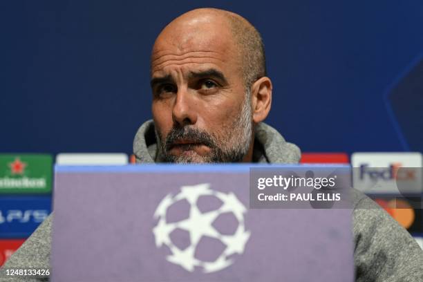 Manchester City's Spanish manager Pep Guardiola reacts as he attends a press conference at Manchester City training ground in Manchester, north-west...