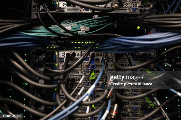 March 2023, Rhineland-Palatinate, Mainz: Cabling for data and cooling of the high-performance computer are seen during the inauguration ceremony of...