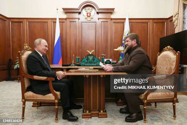 Russian President Vladimir Putin meets with Chechen leader Ramzan Kadyrov at the Kremlin in Moscow on March 13, 2023.