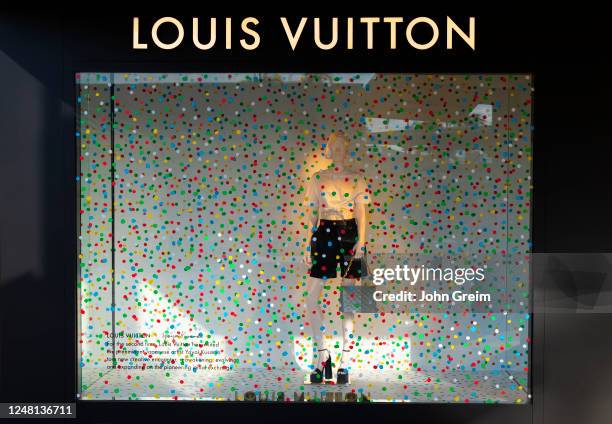 manchester louis vuitton designer exclusive expensive label fashion clothes  worker cleaner man retail brand logo design company Stock Photo - Alamy