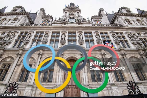 This general view shows the Olympic rings on display in front of The City Hall in Paris on March 13 ahead of the 2024 Olympic Games. - In 500 days,...