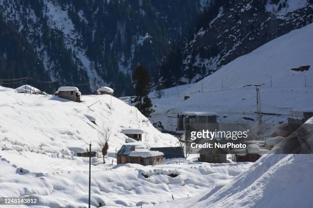 Snow covered mountains on a sunny spring day in Sonmarg tourist destination in Ganderbal District of Indian Administered Kashmir on 13 March 2023.