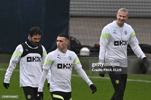 Manchester City's Portuguese midfielder Bernardo Silva, Manchester City's English midfielder Phil Foden and Manchester City's Norwegian striker...