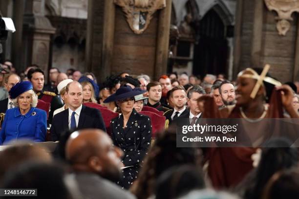 Camilla, Queen Consort, Prince William, Prince of Wales and Catherine, Princess of Wales watch dancers perform, as they attend the annual...