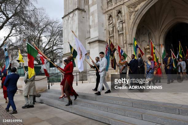 Flag bearers leave Westminster Abbey, in London, on March 13, 2023 at the end of the Commonwealth Day service ceremony.