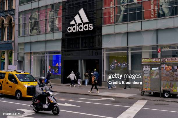 Adidas signage outside a store in the SoHo neighborhood of New York, US, on Sunday, Feb. 26, 2023. Spending by the youngest group of US adults has...