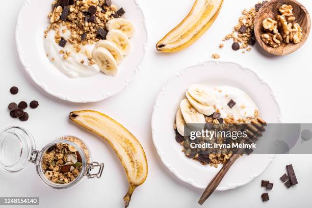 homemade granola on black plate - chocolate white background stock pictures, royalty-free photos & images