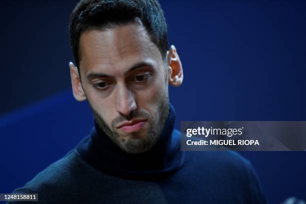 Inter Milan's midfielder Hakan Calhanoglu arrives for a press conference at the Dragao Stadium, in Porto, on March 13 on the eve of the UEFA...