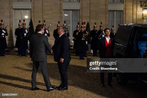 Emmanuel Macron, France's president, left, welcomes for Viktor Orban, Hungary prime minister, ahead of their working dinner at the Elysee Palace in...