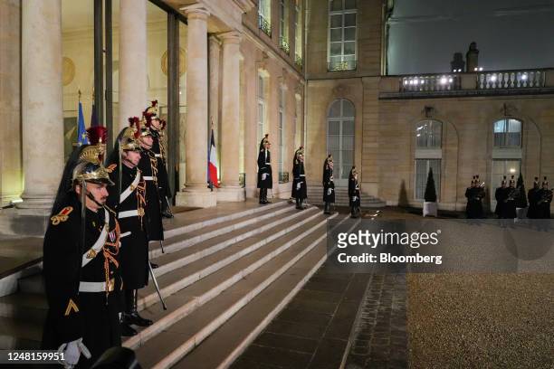 Guards before Emmanuel Macron, France's president, welcomes Viktor Orban, Hungary prime minister, not pictured, ahead of their working dinner at the...