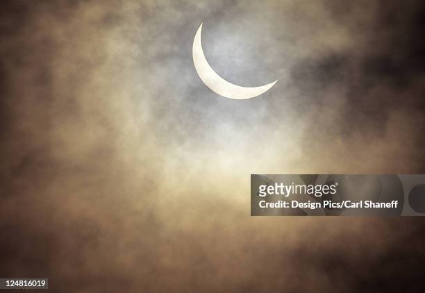 hawaii, oahu, waianae, view of solar eclipse through clouds, july 1991 - july 1991 stock pictures, royalty-free photos & images
