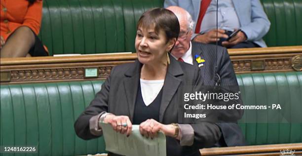 Green Party MP Caroline Lucas finishes her speech on the second reading of the Illegal Migration Bill in the House of Commons, London, by ripping up...