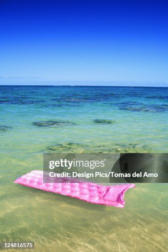 Pink Inflatable Raft Pink Inflated Raft On Clear Ocean Water High-Res Stock Photo - Getty Images