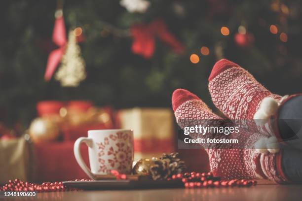 enjoying the peace and expectation of christmas - sock stock pictures, royalty-free photos & images