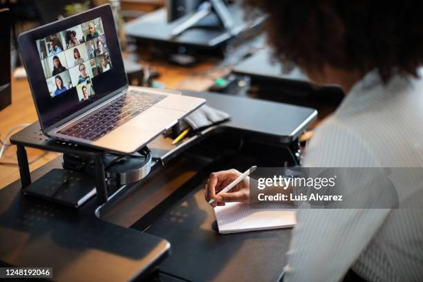 business people having an online meeting in office - elektronisch vergaderen stockfoto's en -beelden