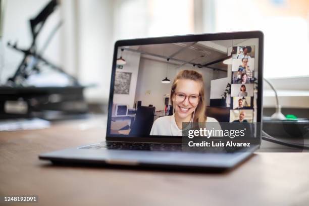 colleagues having a video call meeting in office - young businessman using a virtual screen stockfoto's en -beelden