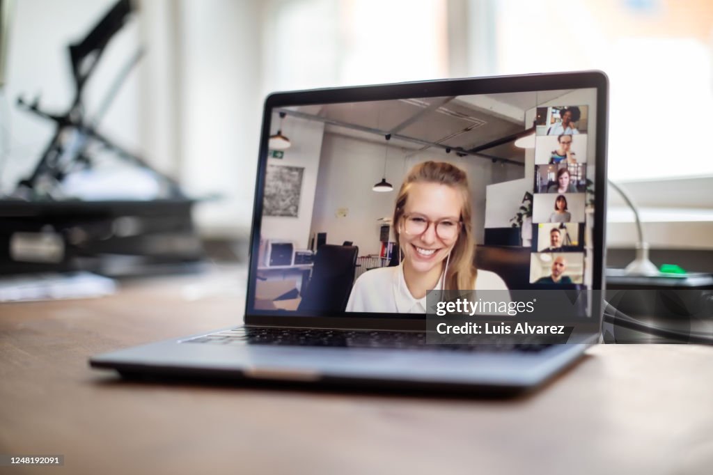 Colleagues having a video call meeting in office