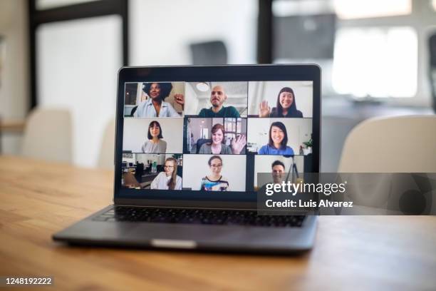 colleagues having a work meeting through a video call - laptop meeting fotografías e imágenes de stock