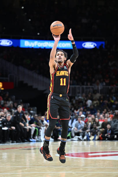 Trae Young of the Atlanta Hawks shoots the ball during the game against the Minnesota Timberwolves on March 13, 2023 at State Farm Arena in Atlanta,...