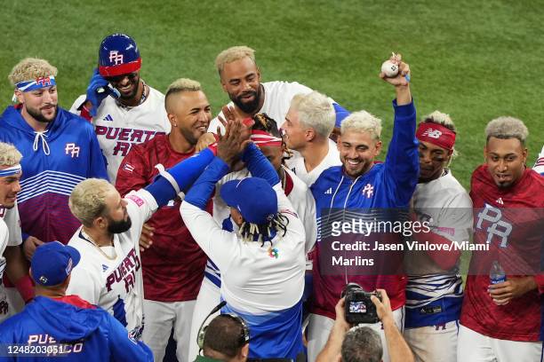 José De León of Puerto Rico holds a ball as he celebrates his combined no-hitter after a walk off win in eight innings over Israel at loanDepot park...