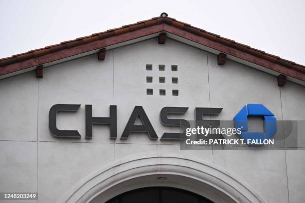 Signage is displayed outside of a Chase Bank branch in Redondo Beach, California, on March 13, 2023. - US President Biden sought to reassure...