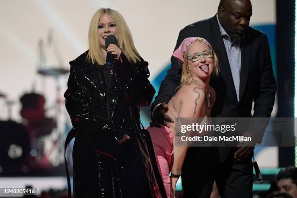 Protestor interrupts Avril Lavigne speaking onstage at the 2023 JUNO Awards at Rogers Place on March 13, 2023 in Edmonton, Canada.