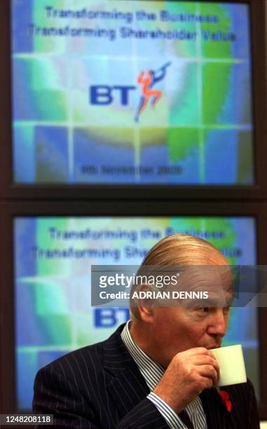 Sir Iain Vallance, Chairman of British Telecom, sips a cup of tea before a press conference at BT Headquaters in London 09 November 2000. The company...