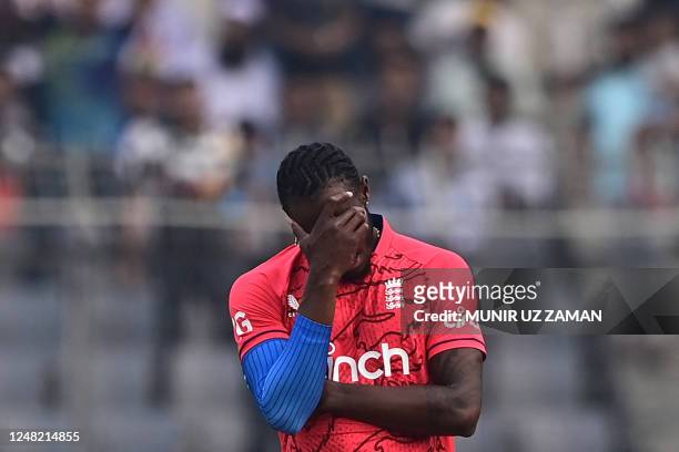 England's Jofra Archer reacts during the third and final Twenty20 international cricket match between Bangladesh and England at the Sher-e-Bangla...