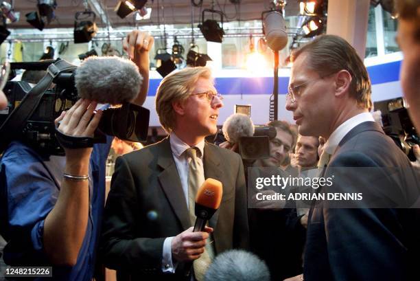 Broadcast executive Thomas Middelhoff , Chief Executive of Bertelsmann, answers questions from a news reporter after the press conference announcing...