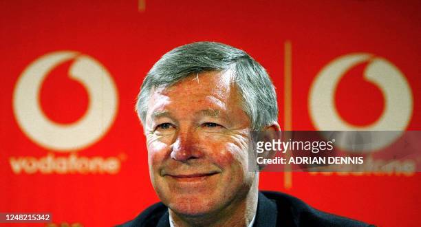 Manchester United's Manager Sir Alex Ferguson smiles during a press conference announcing a new sponsorship deal with the mobile phone company...