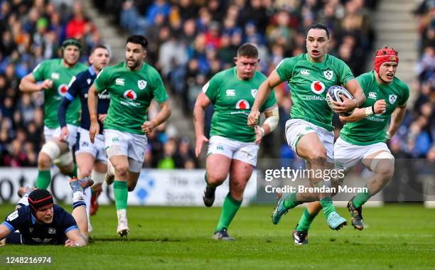 Scotland , United Kingdom - 12 March 2023; James Lowe of Ireland makes a break during the Guinness Six Nations Rugby Championship match between...