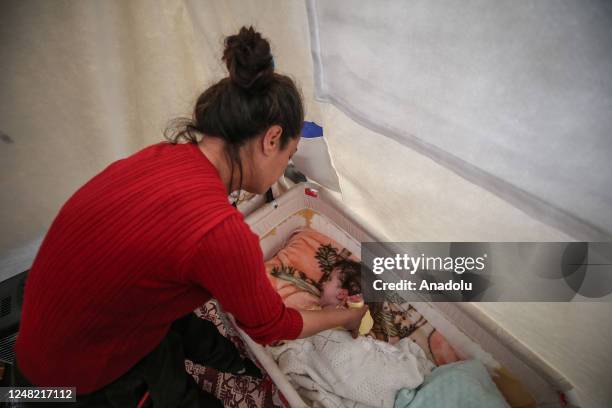 Month-old Alzade baby with hydrocephalus after the earthquake holds onto life with her mother's help after getting a surgery in Hatay, Turkiye on...