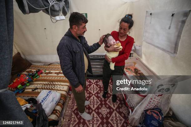 Month-old Alzade baby with hydrocephalus after the earthquake holds onto life with her mother's help after getting a surgery in Hatay, Turkiye on...