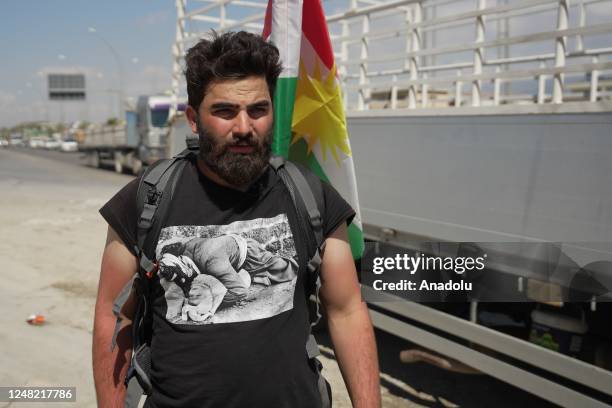 Year-old Iraqi Aram Kovli, departing from Duhok, walks on the road to Halabja in Sulaymaniyah, Iraq on March 13, 2023. He is stepping 55-70 thousands...