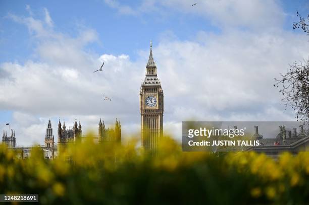 Photograph taken on March 14, 2023 shows the Elizabeth Tower, commonly known by the name of the clock's bell, "Big Ben", at the Palace of...