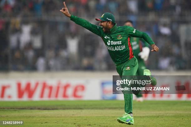 Bangladesh's Mehidy Hasan Miraz celebrates after the dismissal of England's captain Jos Buttler during the third and final Twenty20 international...